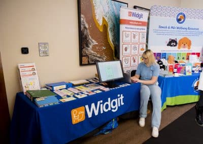 Widgit at the SENsible24 SENCO Conference using a laptop to demonstrate the product.