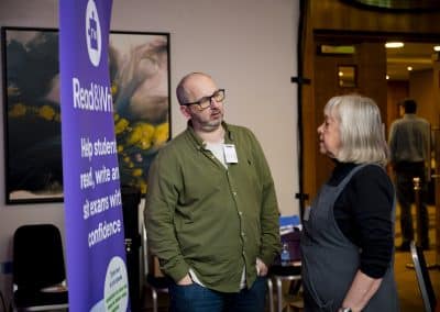 Paddy McGrath from Texthelp talks to a SENCO with the read/write banner in the background