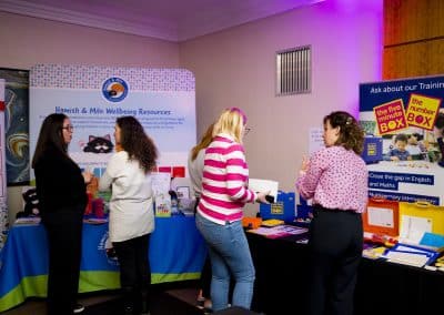 SENCOs talking to the exhibitors at SENSible24 SENCO Conference, with Hamish and Milo SEMH resources and Five Minute Box literacy interventions.