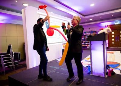 Gavin Hawkins and Dr Susie Nyman create the digest system from balloons on stage at SENsible24 SENCO Conference